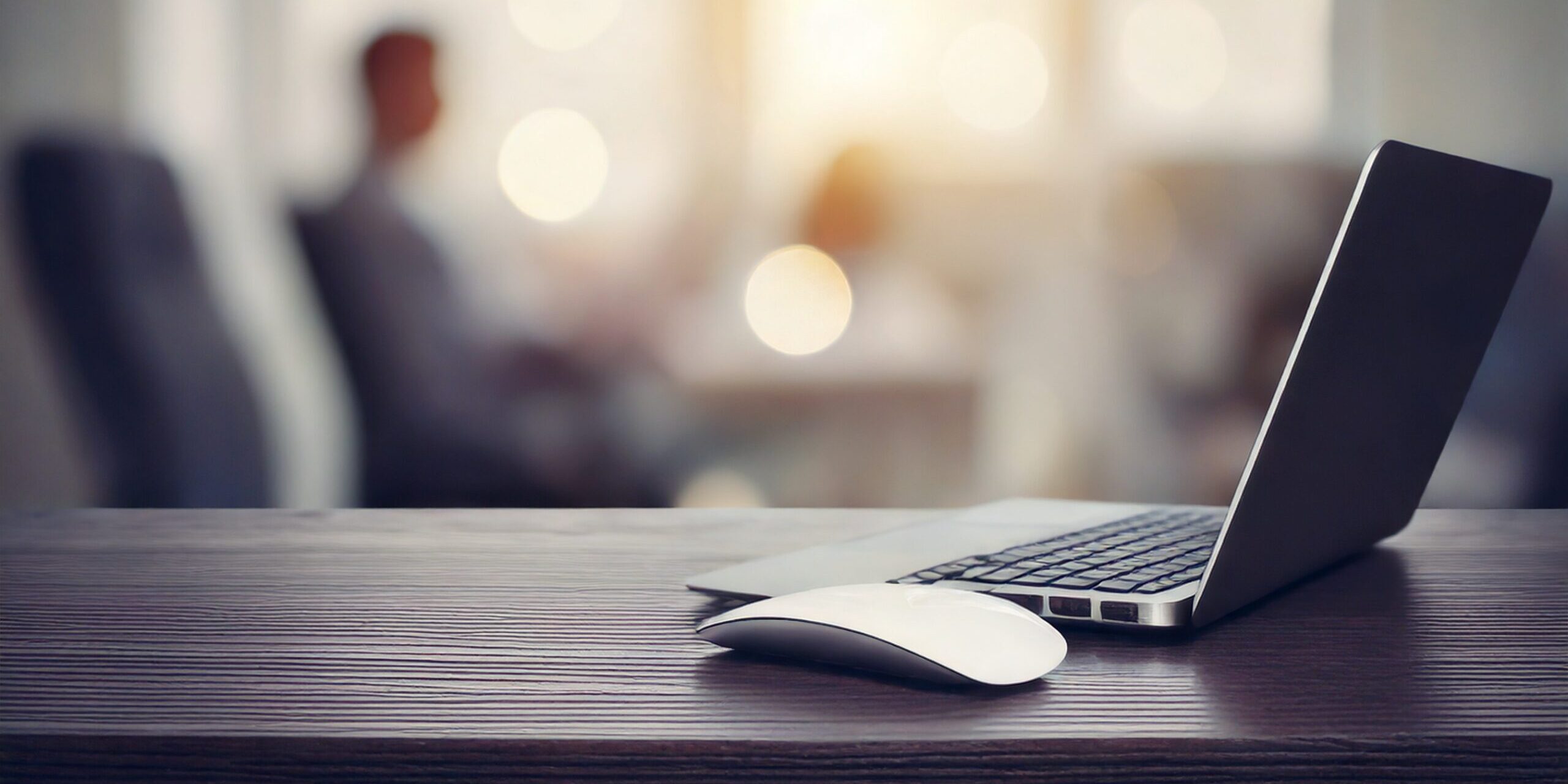 IT Training Skills course website cover image with mouse and modern laptop computer in office